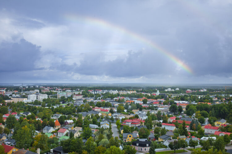 Aerial view of Rauma with a rainbow in the background.