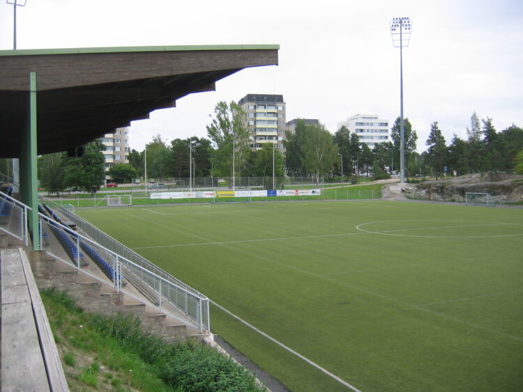 An overview of Äijänsuo's football stadium from the stands.