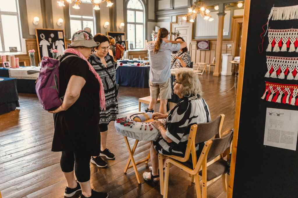 Guests in the bobbin lace exhibit during Lace Week