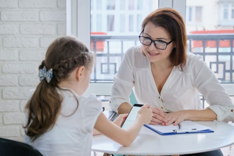 The school counsellor talking to the child.