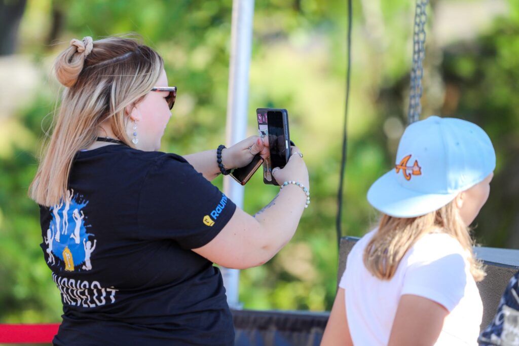 A youth worker taking a photo.